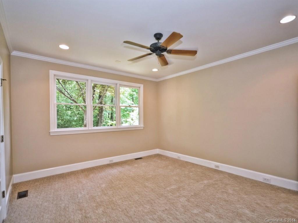 13504 Scanlan Way Davidson, NC 28036 - Photo 13 of 23 an empty room with a window and a fan