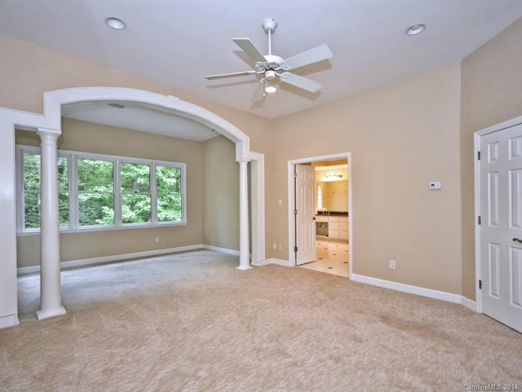 13504 Scanlan Way Davidson, NC 28036 - Photo 19 of 23 a view of a livingroom with a ceiling fan and window