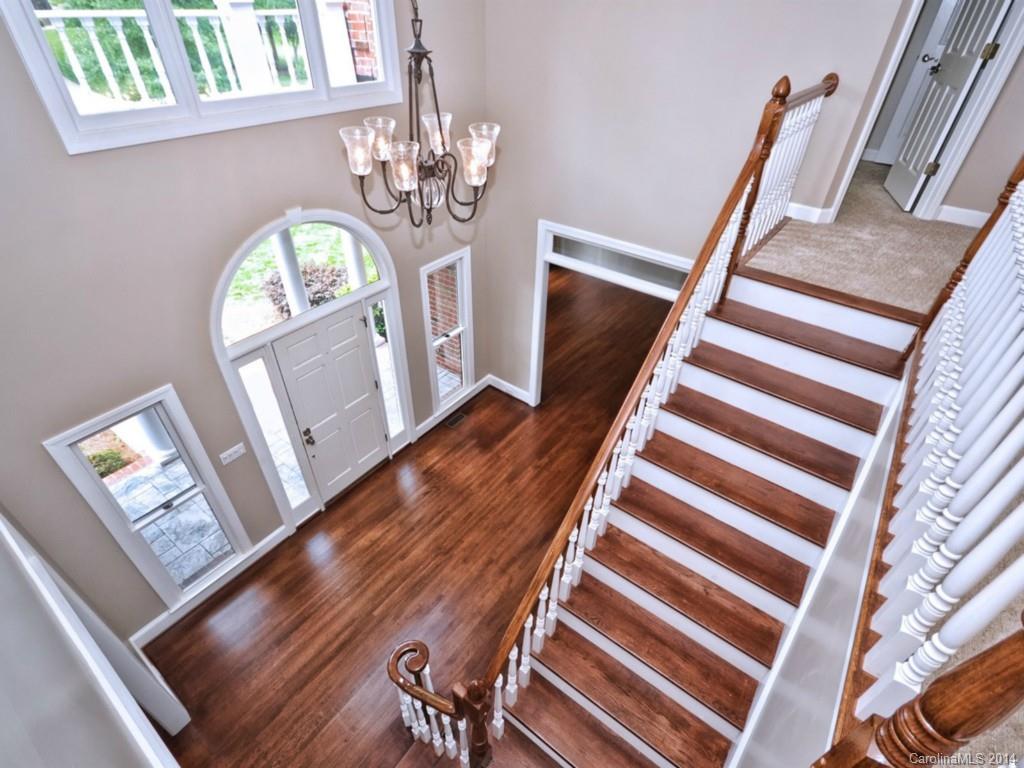 13504 Scanlan Way Davidson, NC 28036 - Photo 4 of 23 a view of entryway with wooden floor