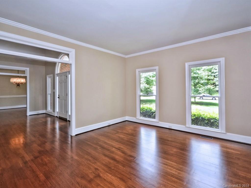 13504 Scanlan Way Davidson, NC 28036 - Photo 6 of 23 an empty room with wooden floor and windows