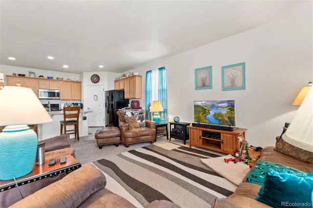 a view of a livingroom with furniture and entryway