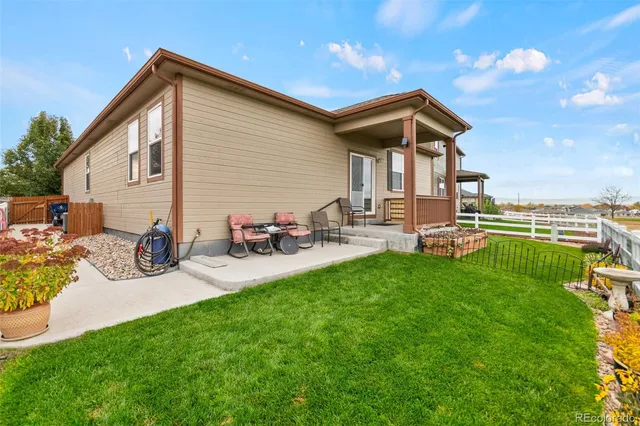 a view of city with tall buildings and a big yard