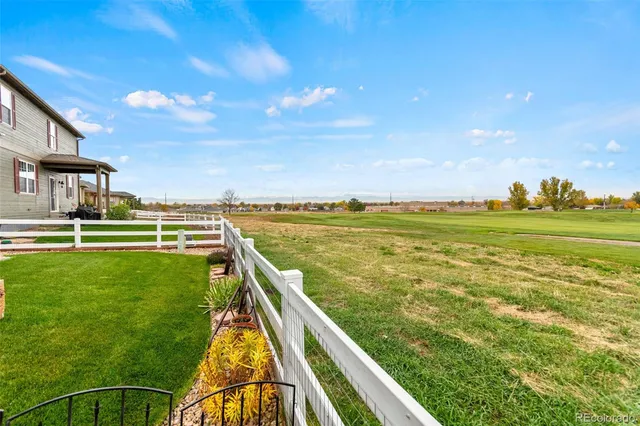 a view of a swimming pool and a yard