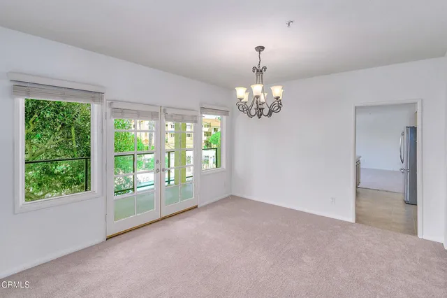 a view of a hallway with a white walls
