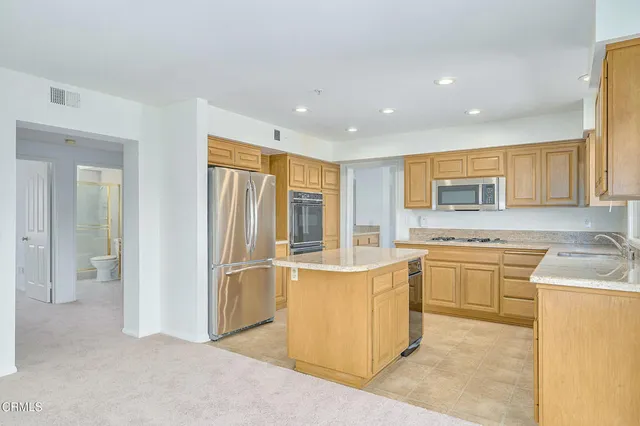 a kitchen with a refrigerator and countertop