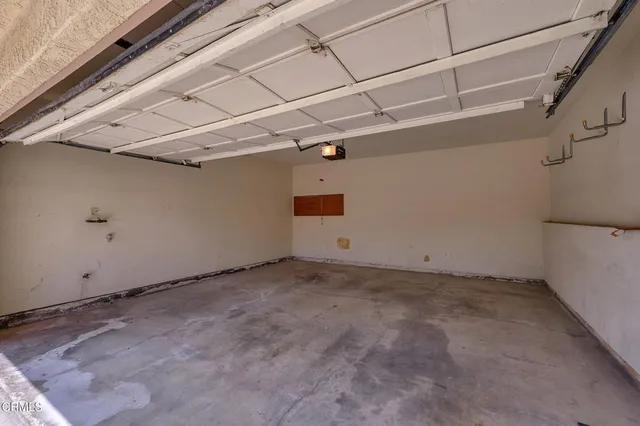 a view of a house with a small yard and plants