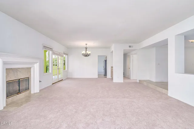 a bathroom with a large window and a lake view