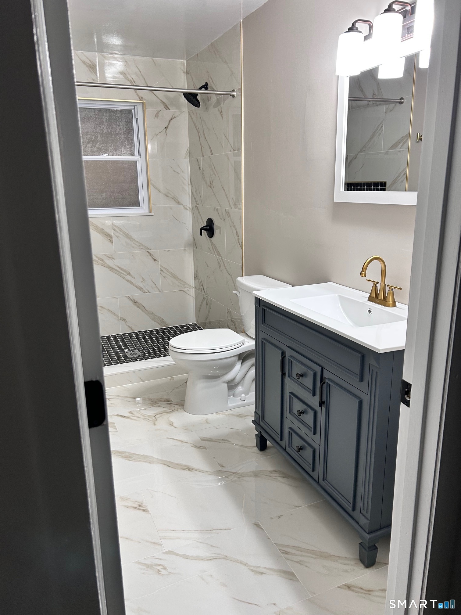 1109 Waterbury Road, Unit 1A Cheshire, CT 06410 - Photo 11 of 15 a bathroom with a sink toilet and shower