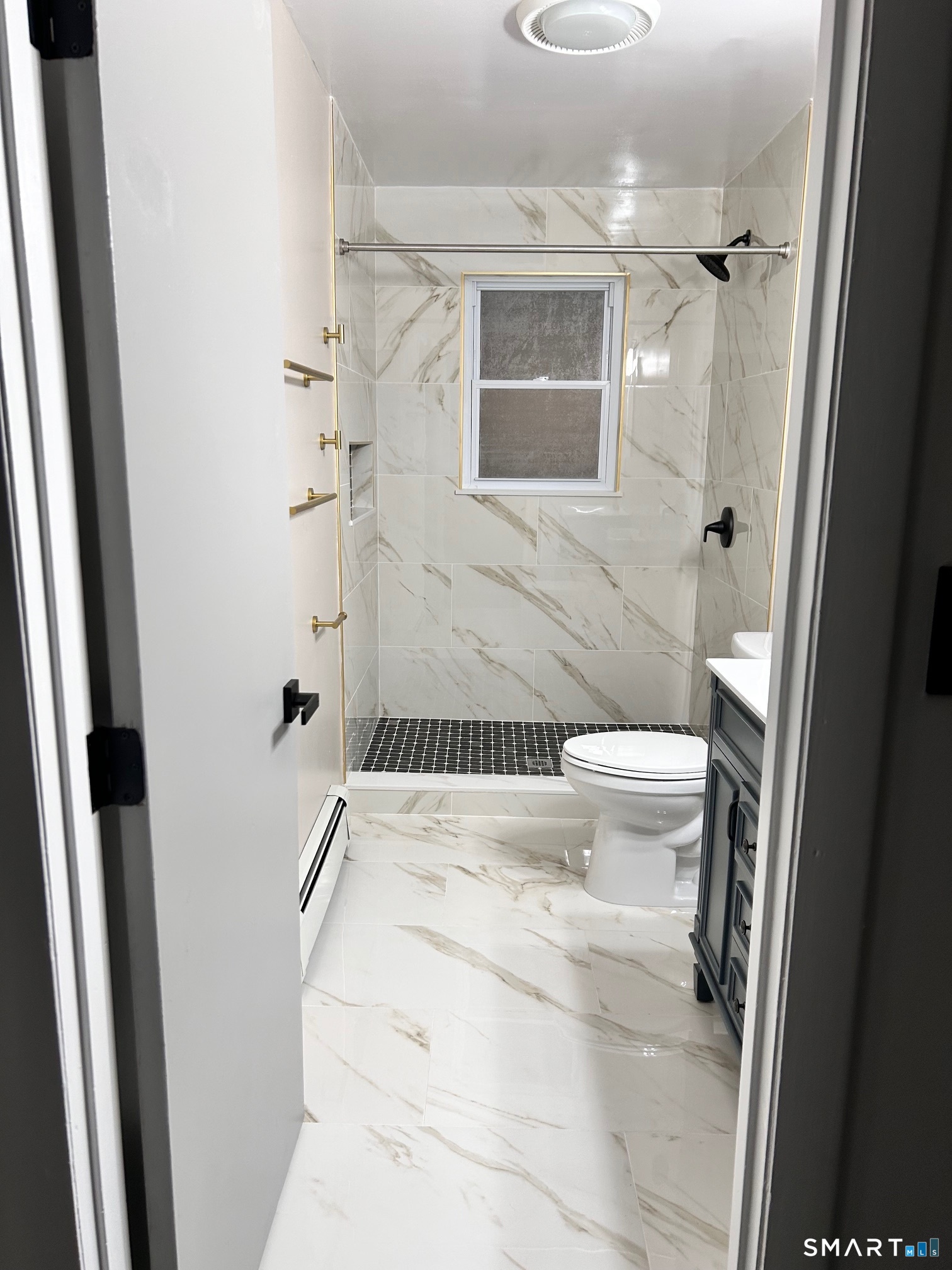 1109 Waterbury Road, Unit 1A Cheshire, CT 06410 - Photo 12 of 15 a bathroom with a shower toilet and sink