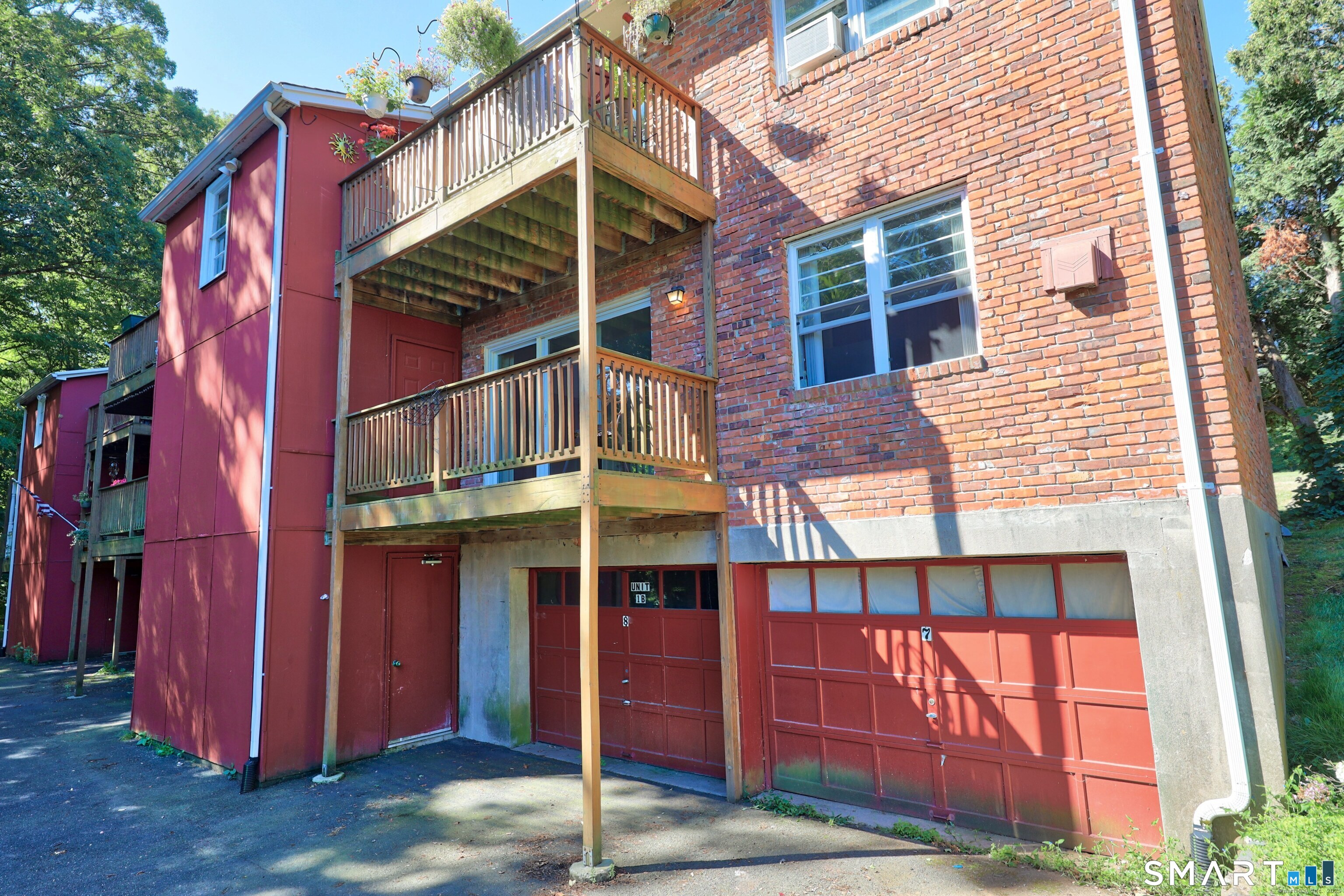 1109 Waterbury Road, Unit 1A Cheshire, CT 06410 - Photo 14 of 15 a view of a house with a porch and a large window
