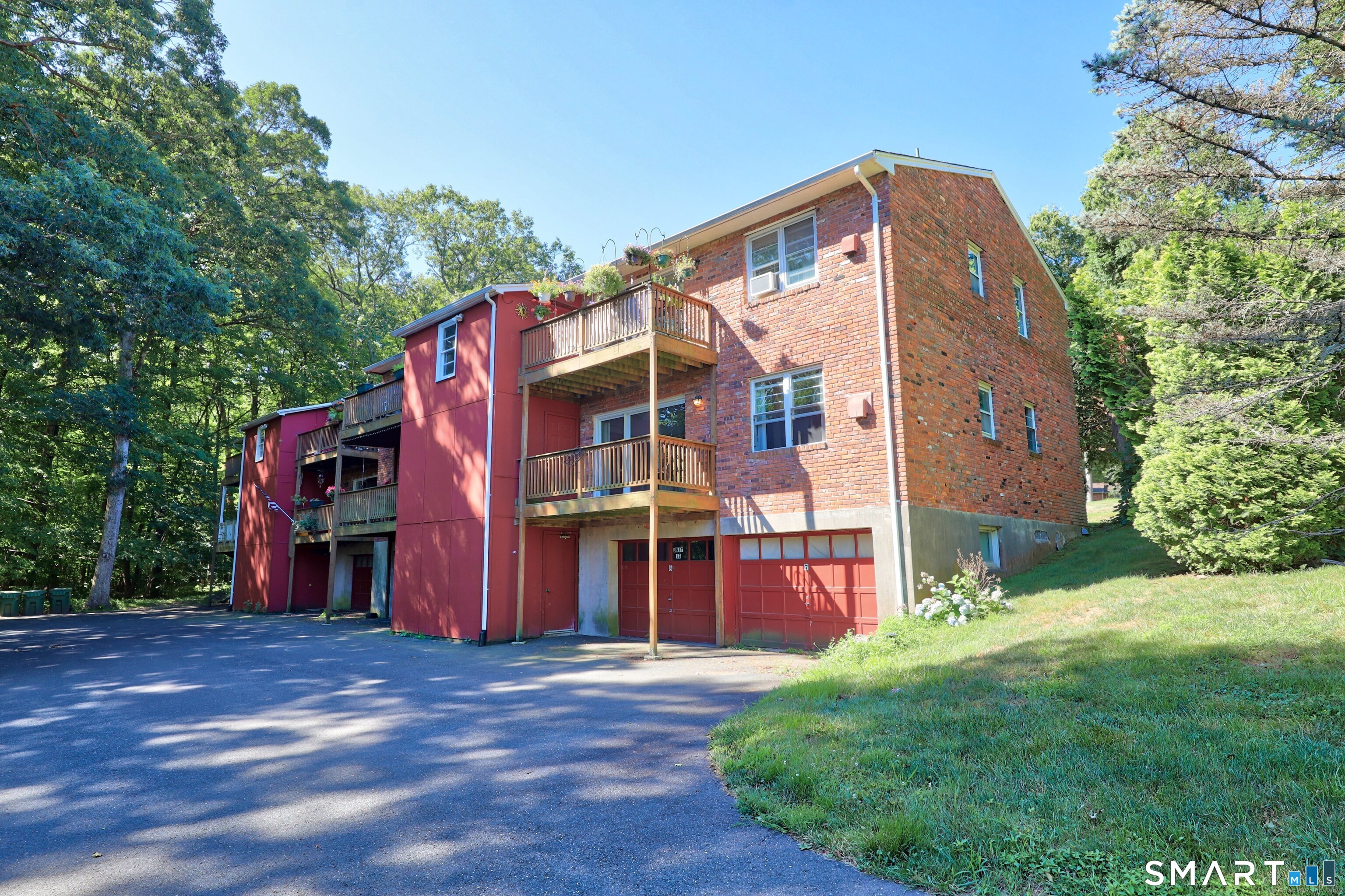 1109 Waterbury Road, Unit 1A Cheshire, CT 06410 - Photo 15 of 15 a front view of a house with a yard