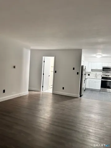 a view of a kitchen with a sink and a stove