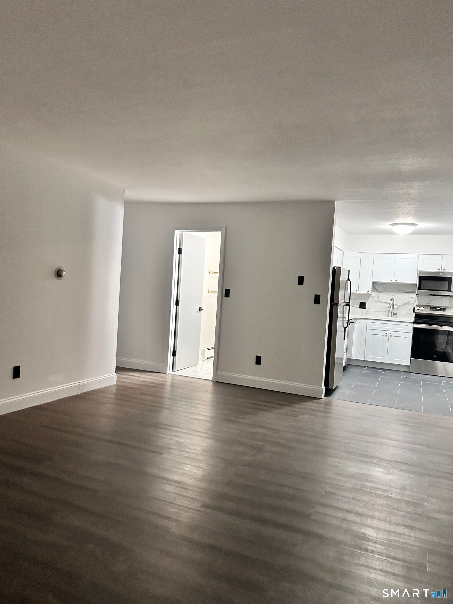 1109 Waterbury Road, Unit 1A Cheshire, CT 06410 - Photo 2 of 15 a view of a kitchen with a sink and a stove