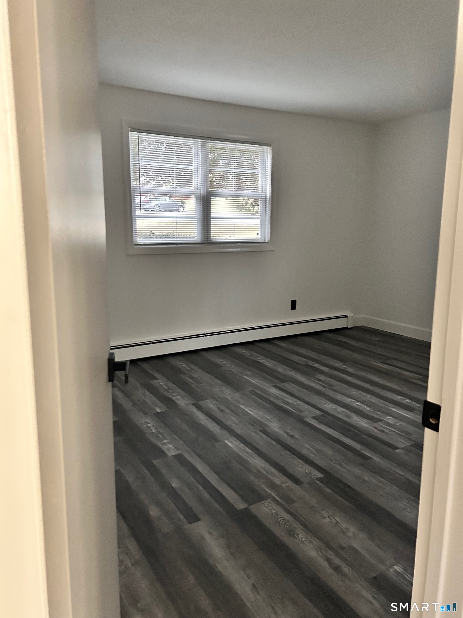 1109 Waterbury Road, Unit 1A Cheshire, CT 06410 - Photo 9 of 15 a view of an empty room with a window