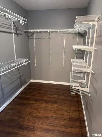 a view of an empty walk in closet
