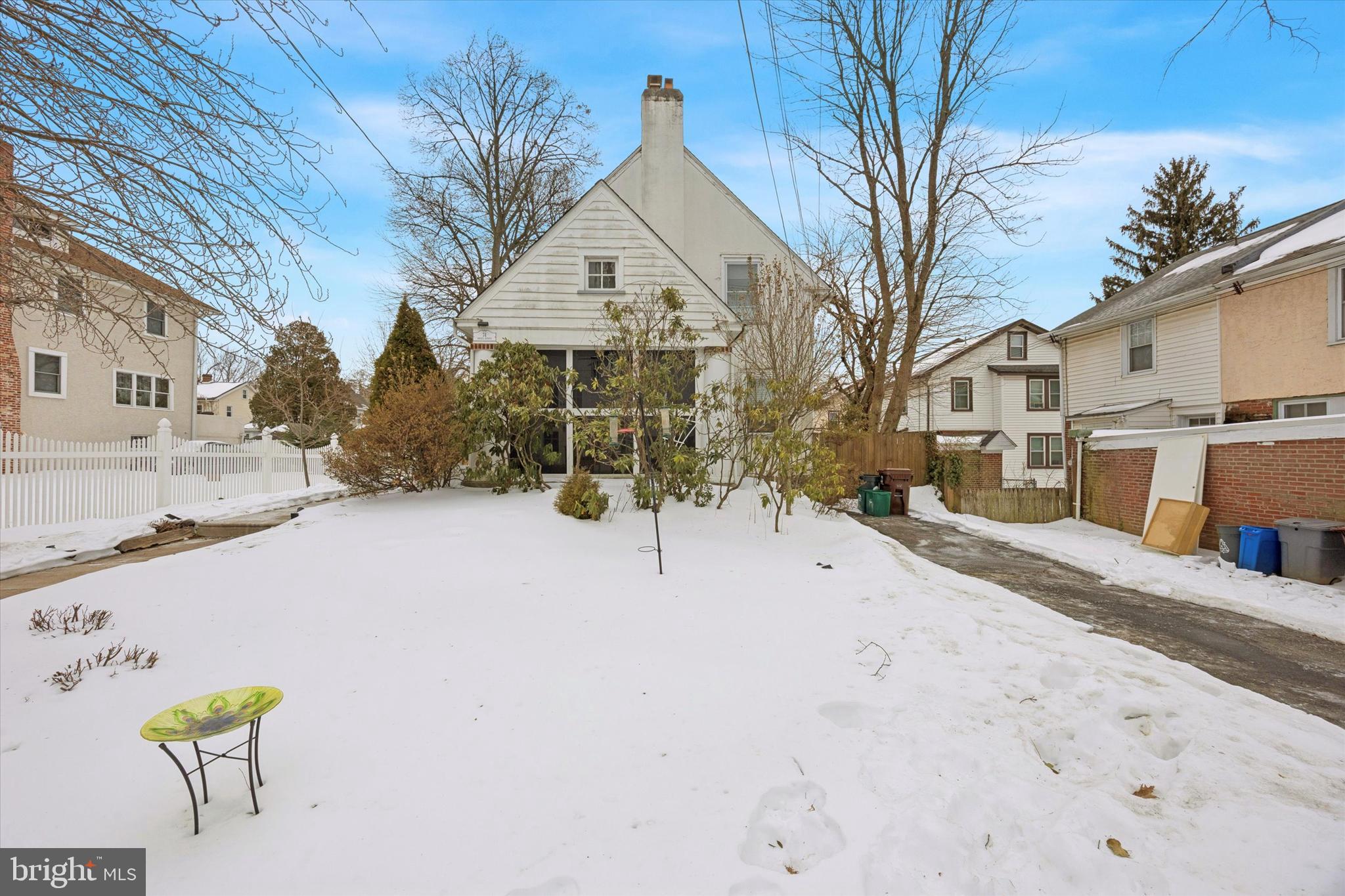 74 Drexel Avenue Lansdowne, PA 19050 - Photo 1 of 15 a view of white house with a yard covered in snow