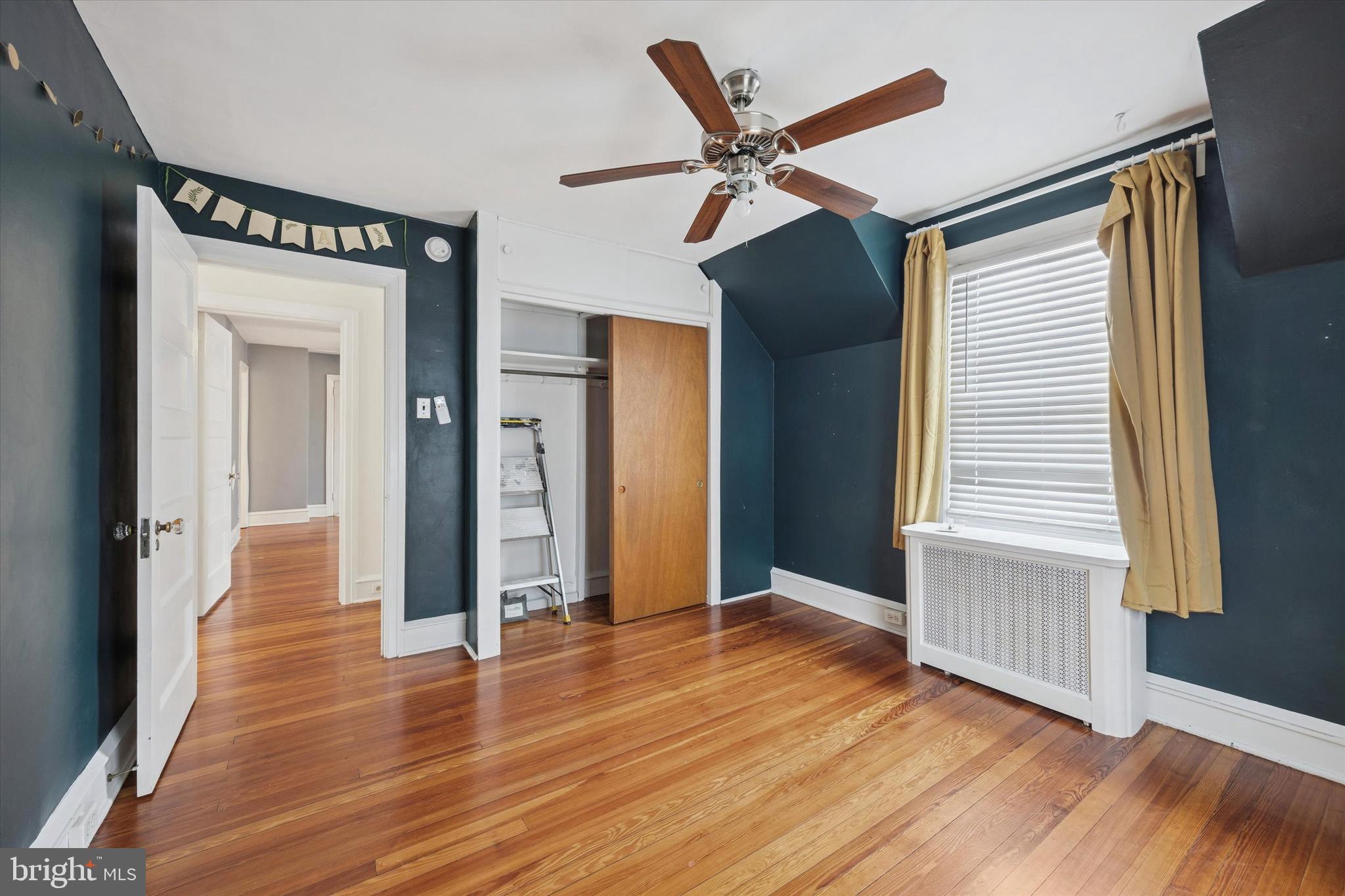 74 Drexel Avenue Lansdowne, PA 19050 - Photo 11 of 15 a view of a livingroom with wooden floor and stairs