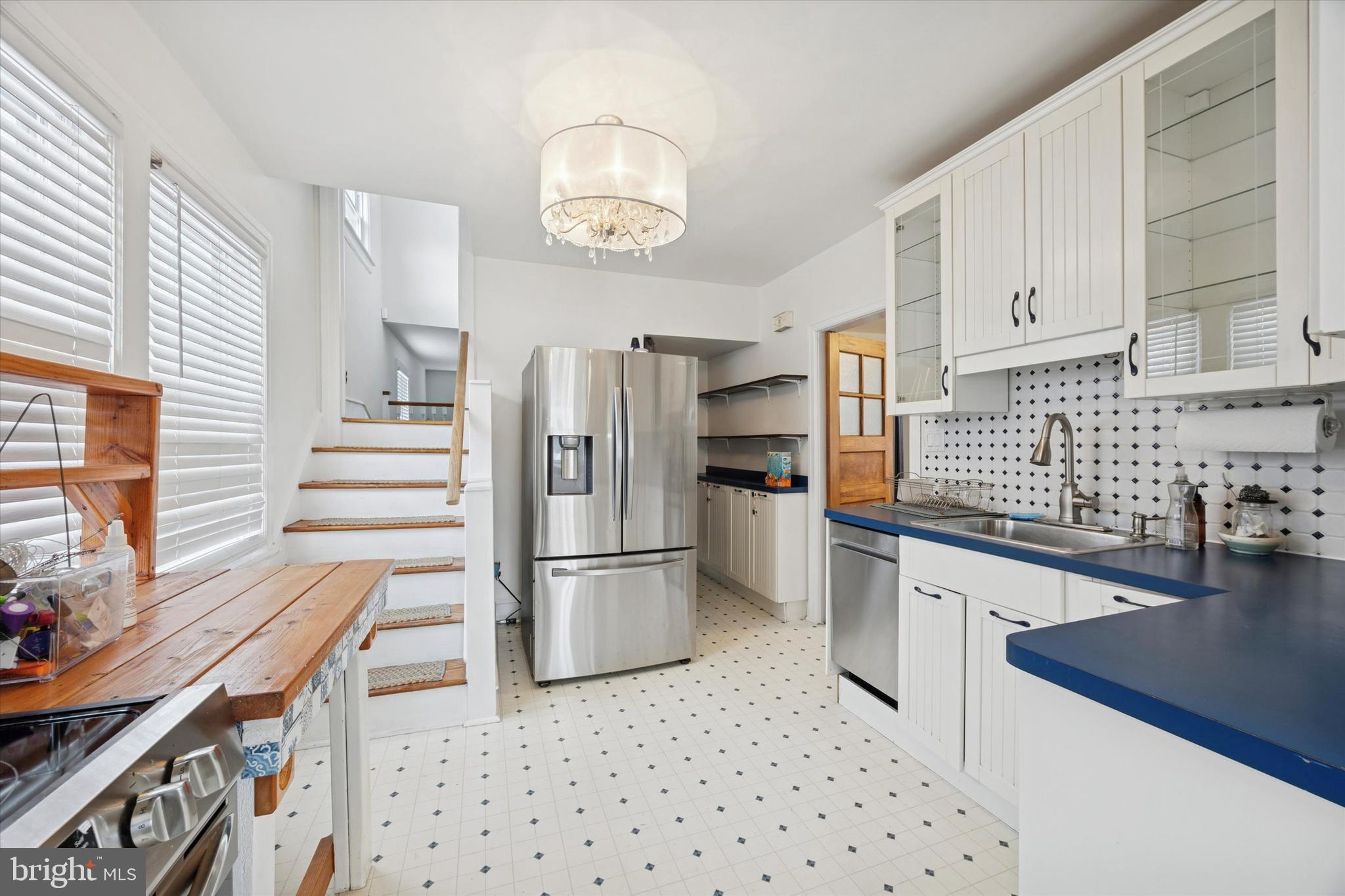 74 Drexel Avenue Lansdowne, PA 19050 - Photo 7 of 15 a kitchen with granite countertop a refrigerator and a stove top oven