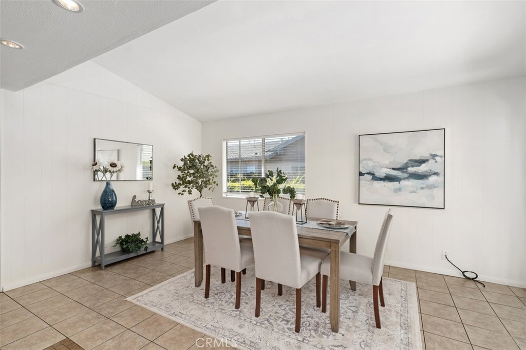 945 Redbud Street Brea, CA 92821 - Photo 14 of 31 a view of a dining room with furniture and wooden floor
