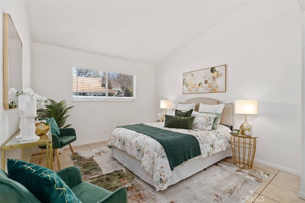 945 Redbud Street Brea, CA 92821 - Photo 17 of 31 a bedroom with a bed a couch and potted plant