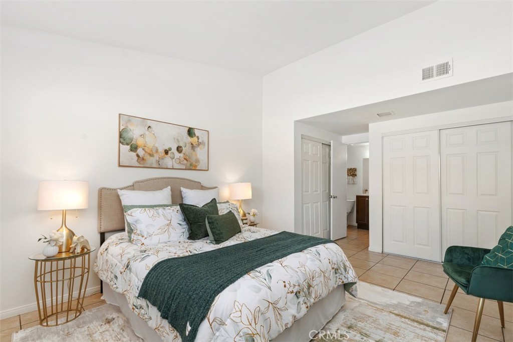 945 Redbud Street Brea, CA 92821 - Photo 18 of 31 a bedroom with a bed and a lamp