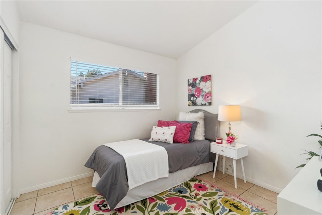 945 Redbud Street Brea, CA 92821 - Photo 20 of 31 a bedroom with a bed and a painting on the wall