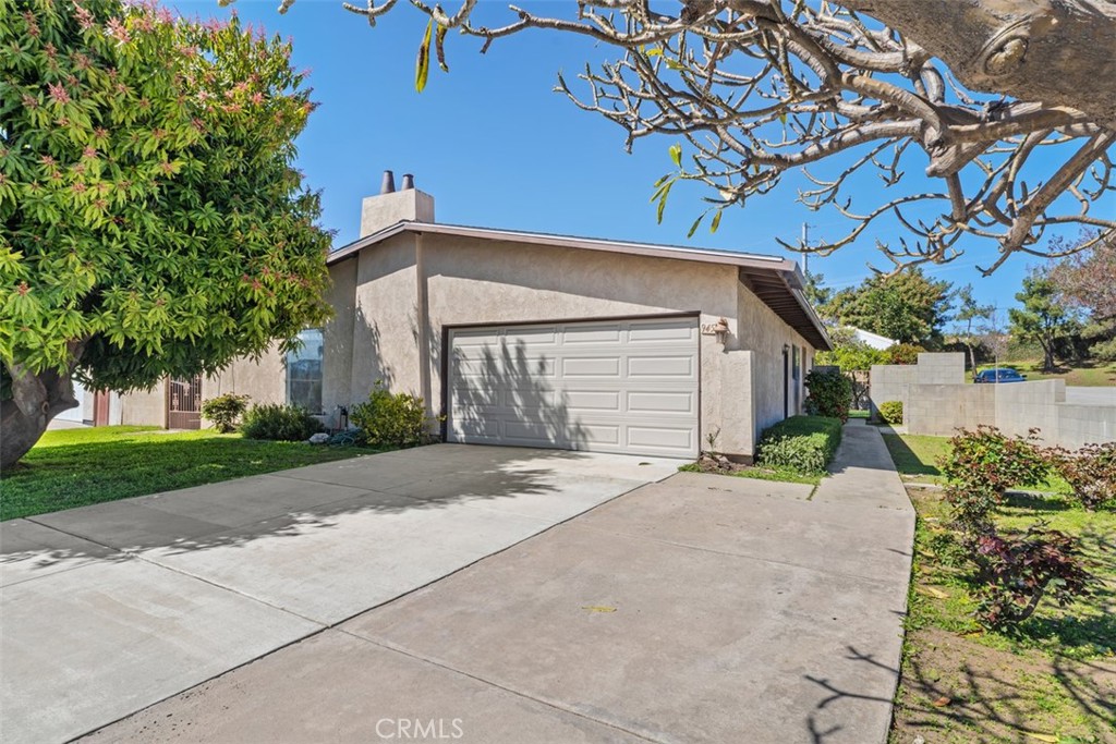 945 Redbud Street Brea, CA 92821 - Photo 2 of 31 a front view of a house with garden