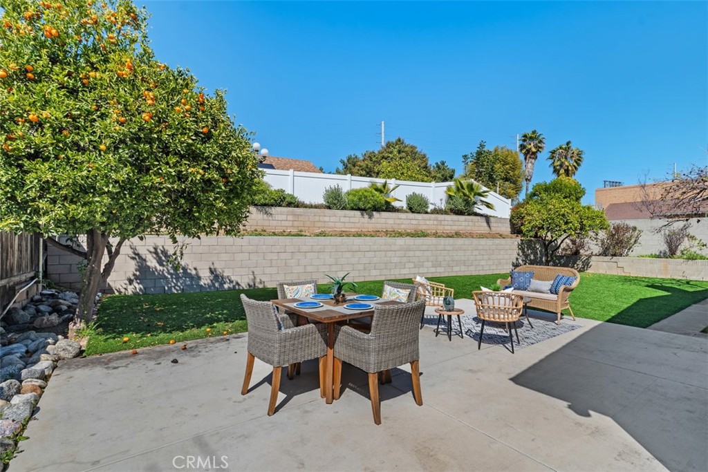 945 Redbud Street Brea, CA 92821 - Photo 26 of 31 a view of backyard with outdoor seating and plants