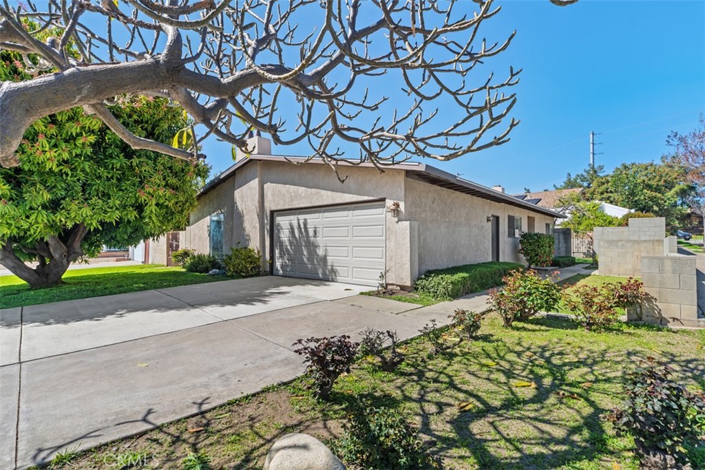 945 Redbud Street Brea, CA 92821 - Photo 3 of 31 a house that has a tree in front of it