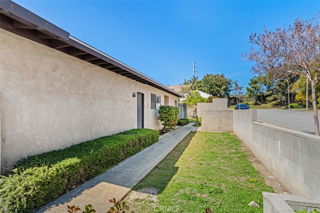 945 Redbud Street Brea, CA 92821 - Photo 4 of 31 a view of a backyard with potted plants