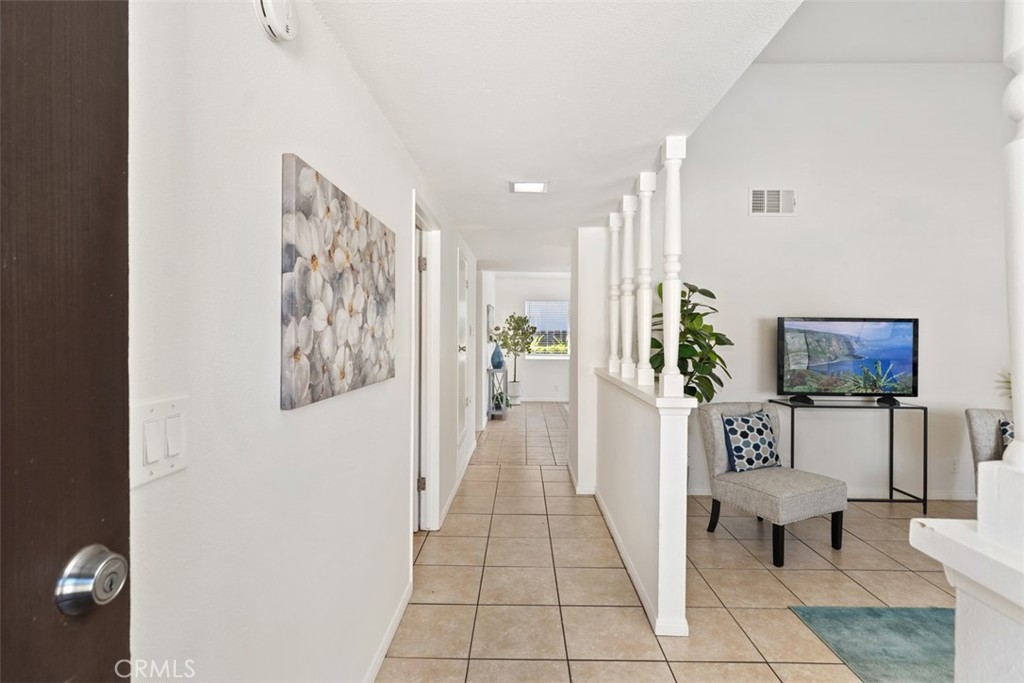 945 Redbud Street Brea, CA 92821 - Photo 5 of 31 a living room with furniture and a flat screen tv