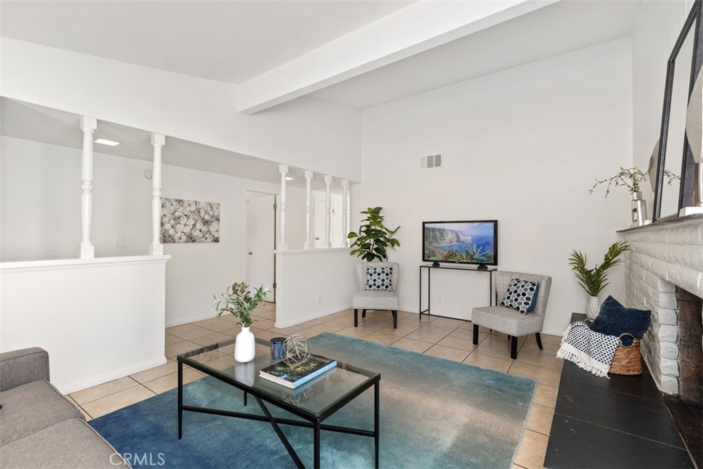 945 Redbud Street Brea, CA 92821 - Photo 7 of 31 a living room with furniture a rug and a flat screen tv