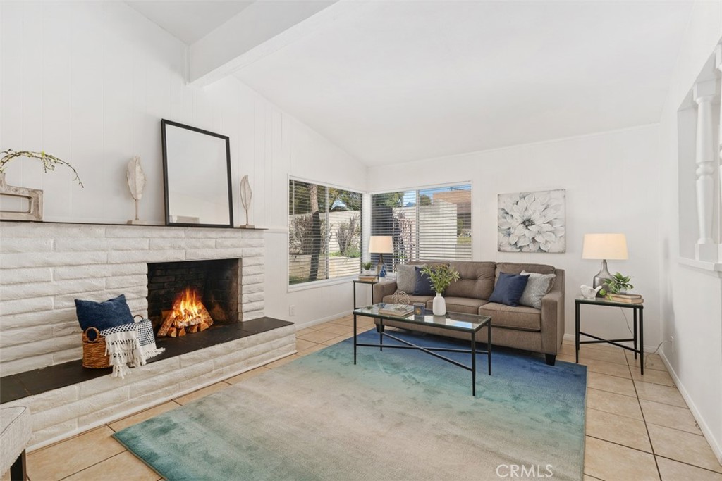 945 Redbud Street Brea, CA 92821 - Photo 9 of 31 a living room with furniture and a fireplace