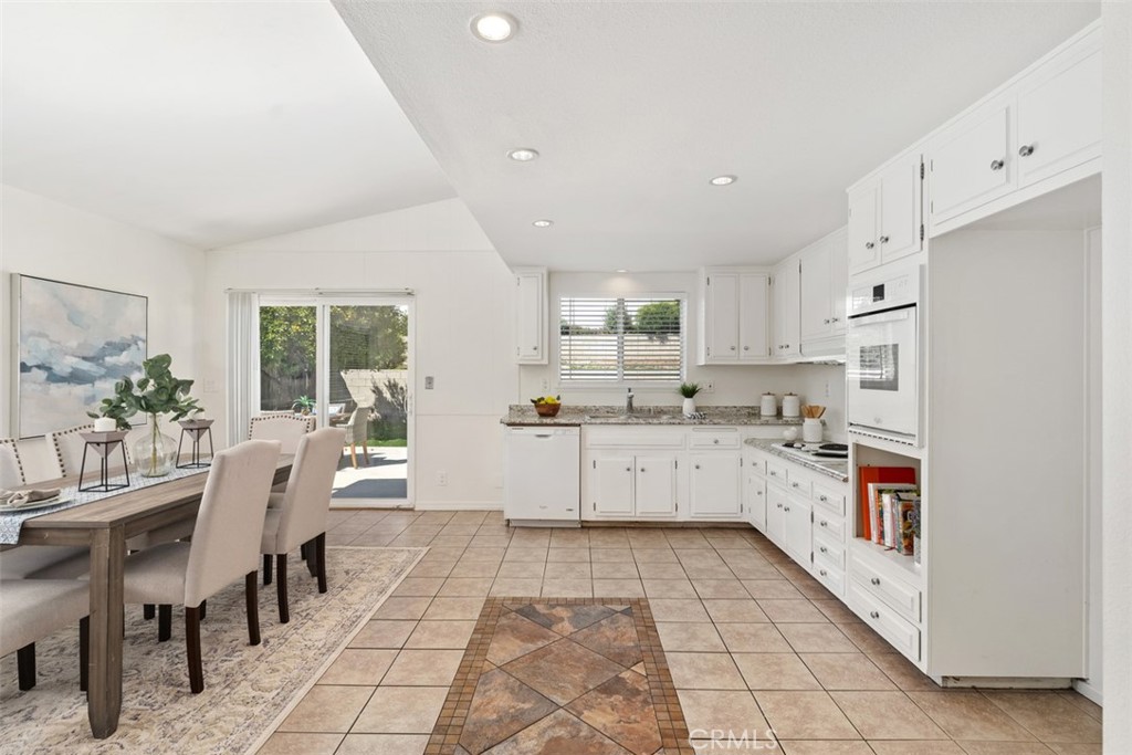 945 Redbud Street Brea, CA 92821 - Photo 10 of 31 a kitchen with stainless steel appliances granite countertop a refrigerator sink and cabinets