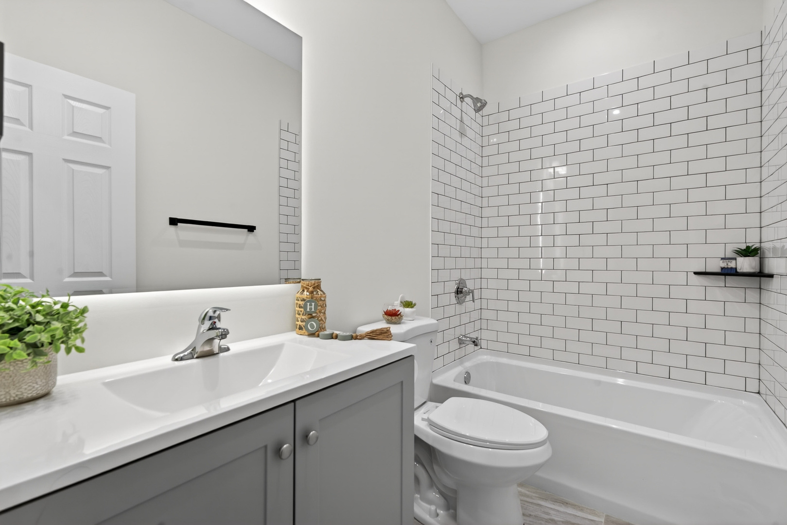 1002 Joshua Lane Genoa, IL 60135 - Photo 25 of 42 a bathroom with a sink a toilet and a bathtub