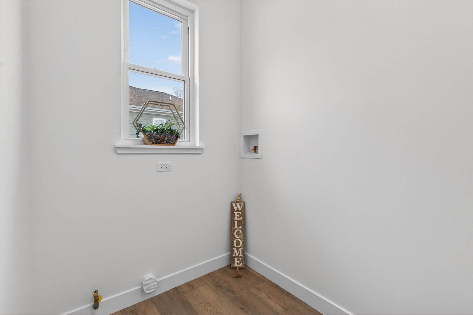 1002 Joshua Lane Genoa, IL 60135 - Photo 29 of 42 an empty room with wooden floor and window