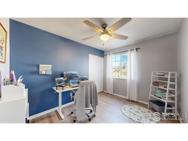 a living room with a couch and a chandelier