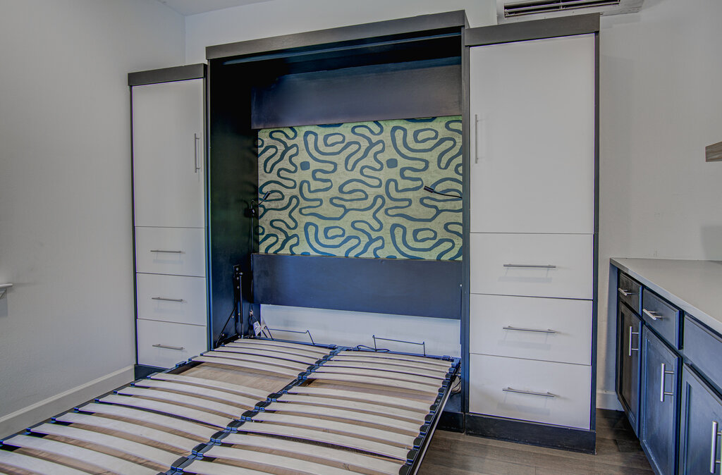2406 East 16th Street Austin, TX 78702 - Photo 38 of 39 a bedroom with a bed and a window