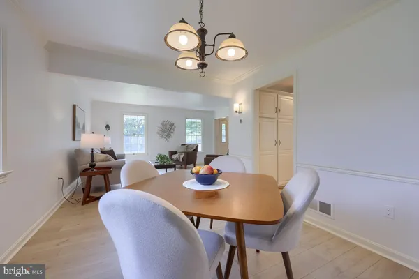 a view of a dining table and chairs in a room