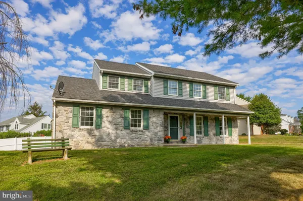 an aerial view of residential house with outdoor space and swimming pool