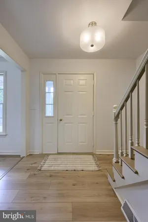 a view of a livingroom with wooden floor
