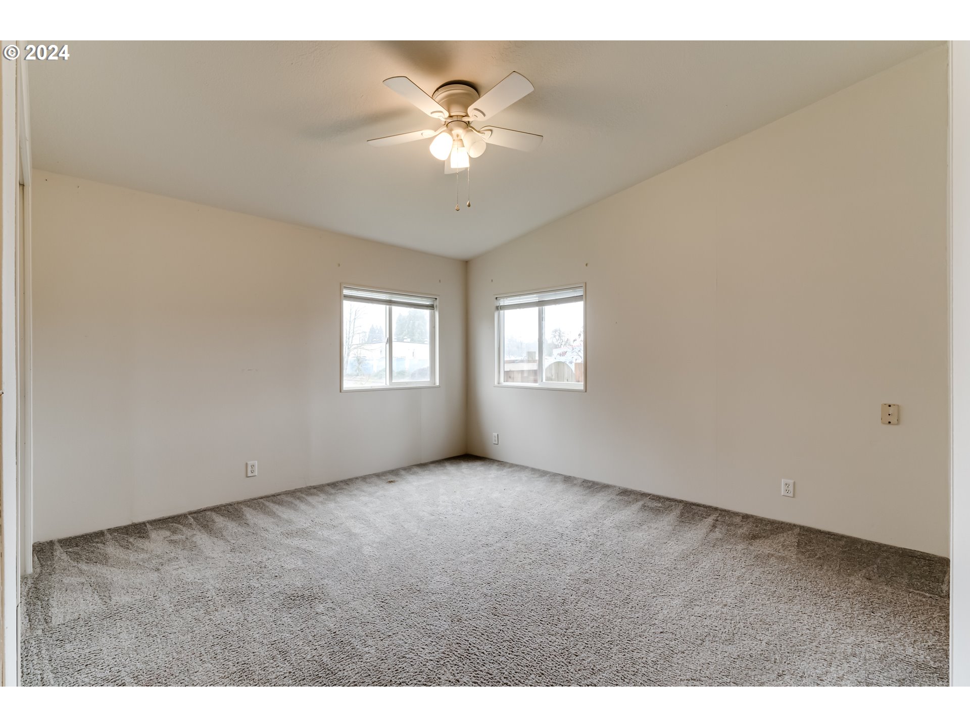 301 Smith Loop Springfield, OR 97478 - Photo 12 of 32 a view of an empty room with a window