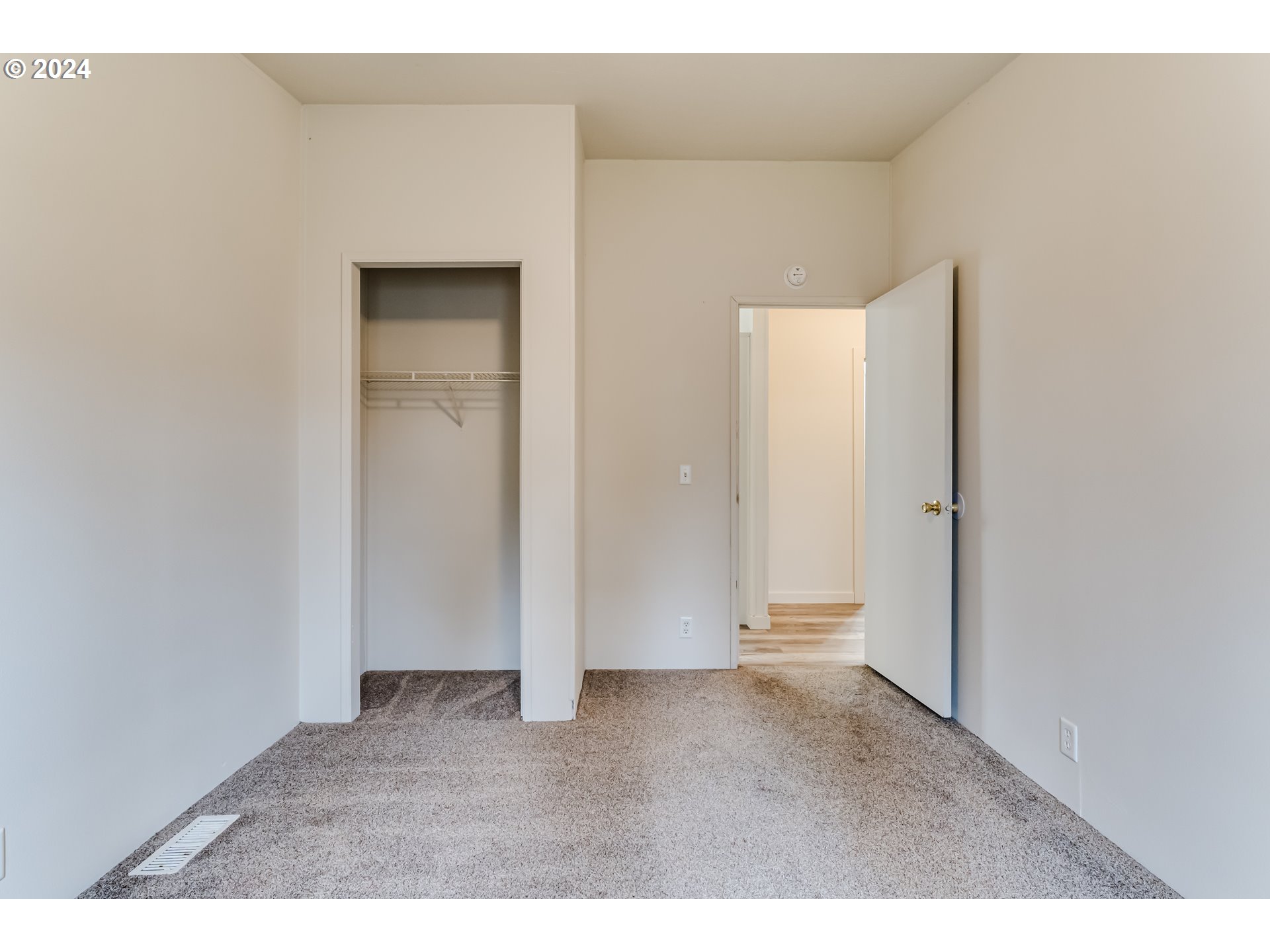 301 Smith Loop Springfield, OR 97478 - Photo 21 of 32 a view of an empty room with wooden floor