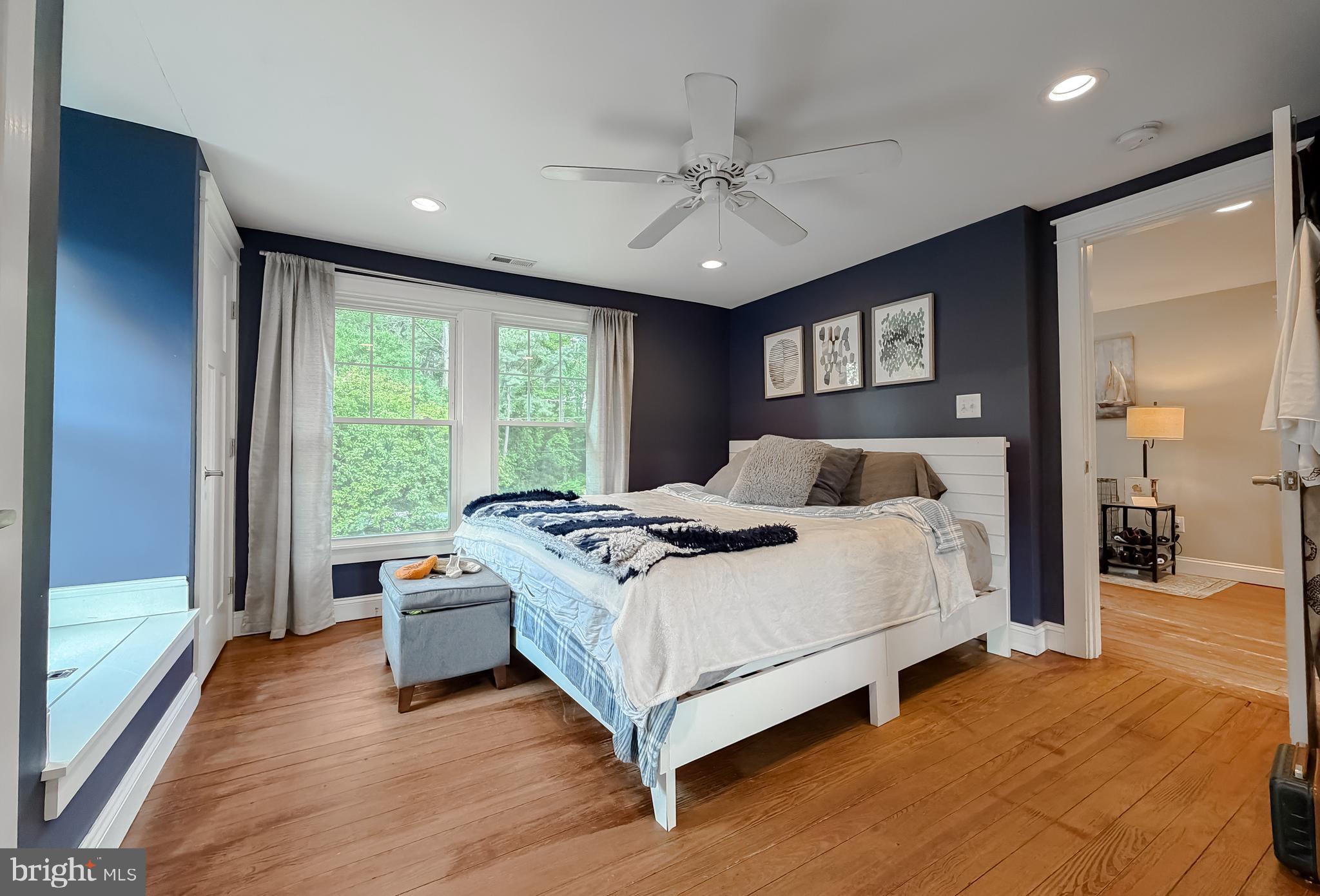 16146 Thomas Road Piney Point, MD 20674 - Photo 20 of 57 a bedroom with a large bed and a large window