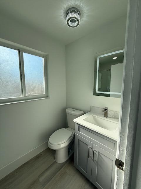 28 Southwest 9th Avenue Boca Raton, FL 33486 - Photo 14 of 16 a bathroom with a toilet sink and mirror
