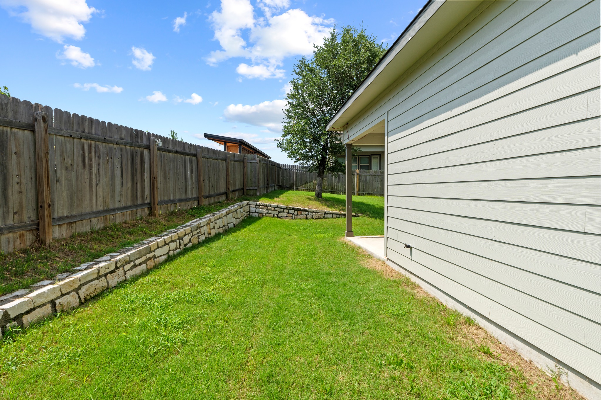 1101 Skeeter Cove Austin, TX 78748 - Photo 28 of 31 A well-maintained fenced yard offers a private outdoor space for relaxation.