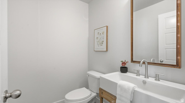 2038 East Ranch Road Eagle Mountain, UT 84005 - Photo 24 of 66 Bathroom with a rectangular vessel sink featuring a single-handle faucet and two-handle controls