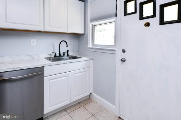 a view of cabinets with sink