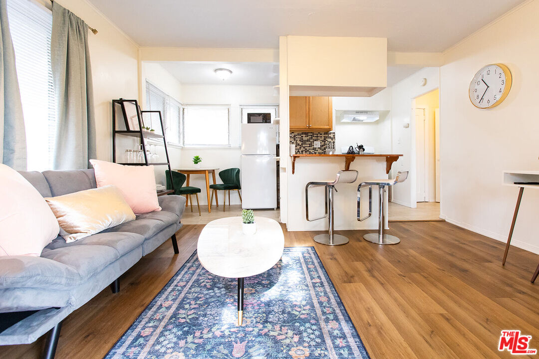 a living room with furniture and a table