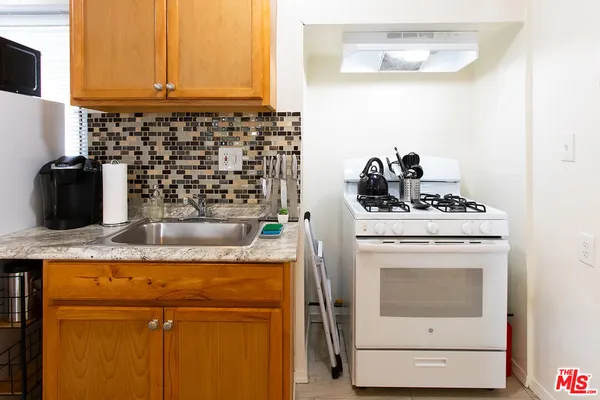 a kitchen with a stove and a microwave